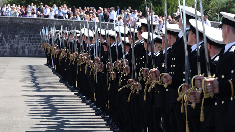 The newly commissioned officers hold their ceremonial swords (Picture: Royal Navy) The newly-commissioned officers hold their ceremonial swords (Picture: Royal Navy)