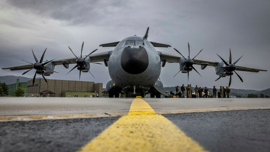 An RAF A400M Atlas provides a different kind of top cover as US Marines shelter from the rain under the wing of the aircraft at Trondheim Garrison in Norway An RAF A400M Atlas provides a different kind of top cover as US Marines shelter from the rain under the wing of the aircraft at Trondheim Garrison in Norway