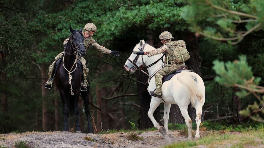 Map reading from the saddle will be a vital skill to master should these soldiers ever have to carry out a mounted reconnaissance mission in wartime