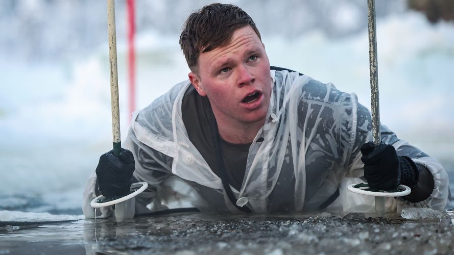 Personnel conduct ice-breaking drills at the end of the Cold Weather Aviation Operator Course during Operation Clockwork in Bardufoss