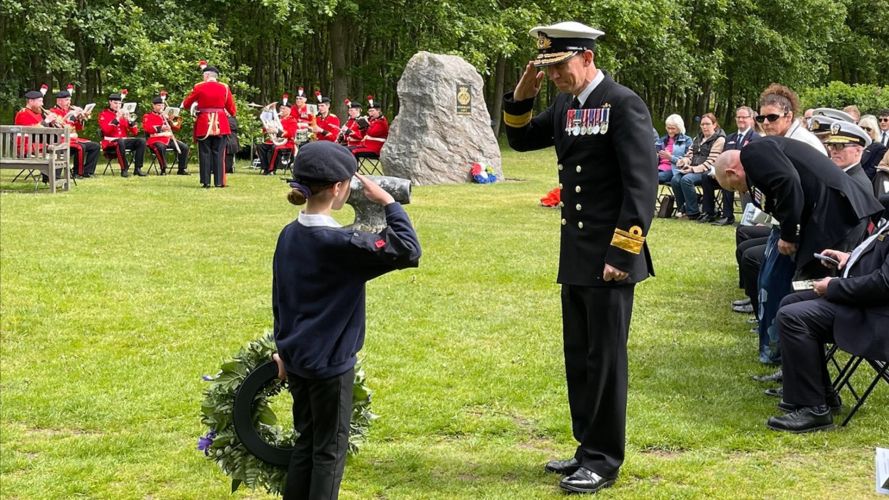 Cadet forces also paid their respects, with Rear Admiral Perks returning the salute from a young wreath-bearer (Picture: Leigh Dodds)