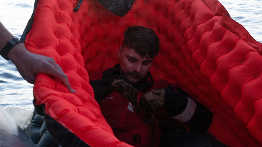 A US Air Force Airman is loaded into a small raft during Exercise Bamboo Eagle 