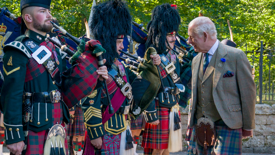 The pipe band of 3 & 4 SCOTS, Royal Regiment of Scotland as King Charles III carries out an inspection of the Balaklava Company, 5th Battalion, The Royal Regiment of Scotland