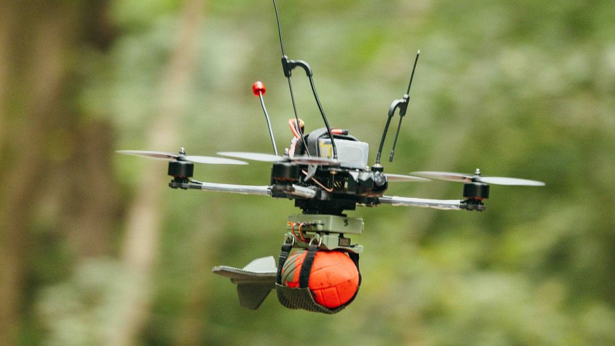 A first-person view drone flies towards an enemy position carrying a dummy munition during the British Army tactical drone championship at Royal Military Academy Sandhurst