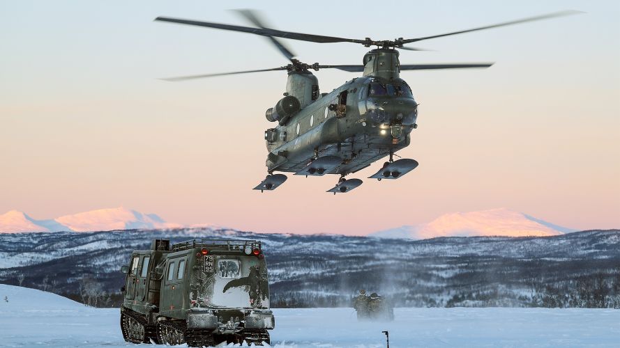An RAF Chinook fitted with snow skis from 18 Squadron carries out underslung load lift training in Norway