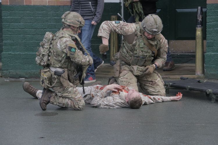1st Battalion soldiers practice giving emergency aid and extracting a casualty