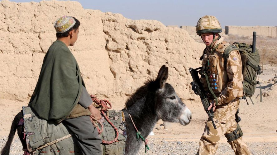 Prince Harry passes a donkey while on patrol through the deserted town of Garmsir, Afghanistan (Picture: PA Images) Prince Harry passes a donkey while on patrol through the deserted town of Garmsir, Afghanistan (Picture: PA Images)