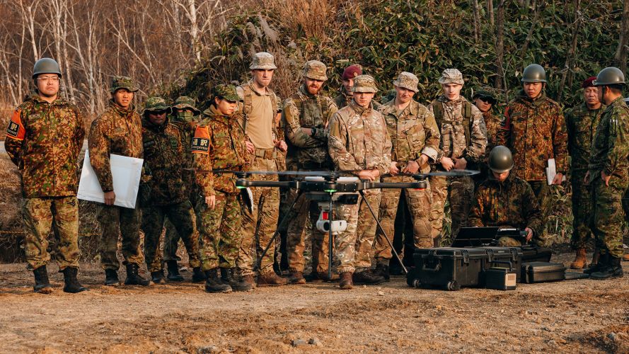 The Japanese Ground Self Defence Forces' show off their drone to paratroopers from the reconnaissance platoon, D Company 