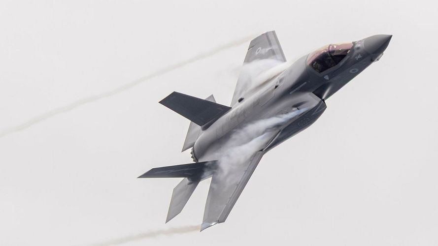 An F-35B Lightning makes a flypast of the UK Carrier Strike Group having taken off from the flagship, HMS Prince of Wales