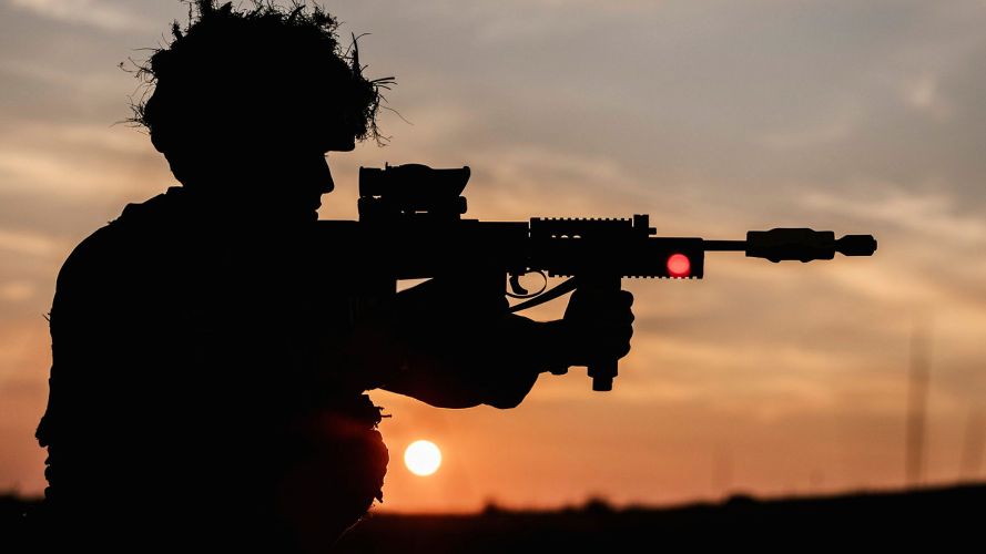 This 222 Signal Squadron soldier shoulders his SA80 L85A2 with a blank firing attachment fitted A 222 Signal Squadron soldier shoulders his SA80 L85A2 with a blank firing attachment fitted