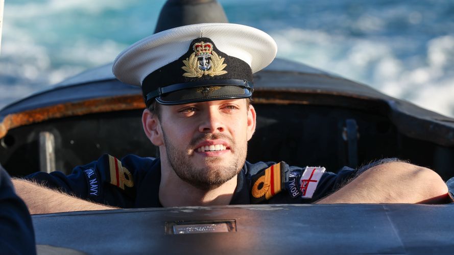 A crewmember of hunter-killer submarine HMS Anson pops his head out as the boat arrives in Australia for an historic visit to strengthen the UK's commitment to the security of the Indo-Pacific