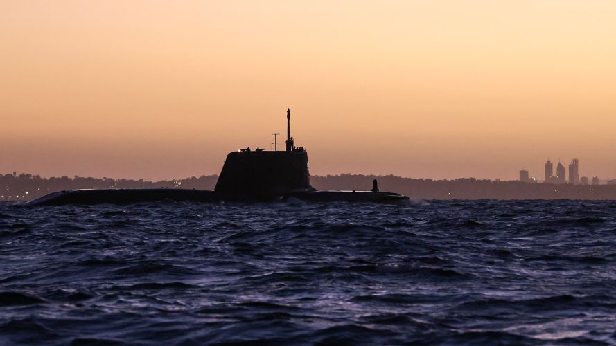 HMS Anson prepares to enter HMAS Stirling, a Royal Australian Navy base in Western Australia, with the state capital Perth in the background