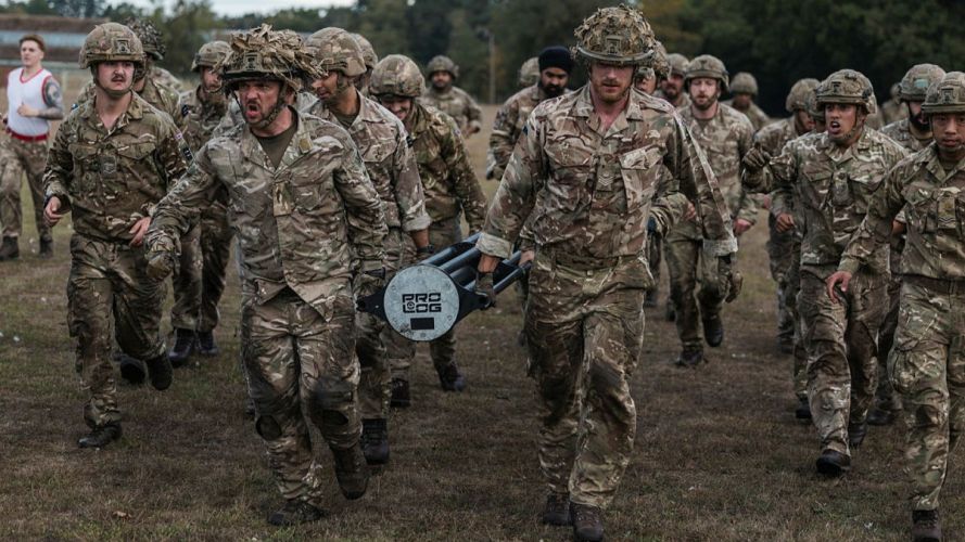 255 (Special Operations) Signal Squadron taking part in Battle PT during their Formation Day – shown here doing a log run (Picture: MOD) 255 (Special Operations) Signal Squadron taking part in Battle PT during their Formation Day cred MOD