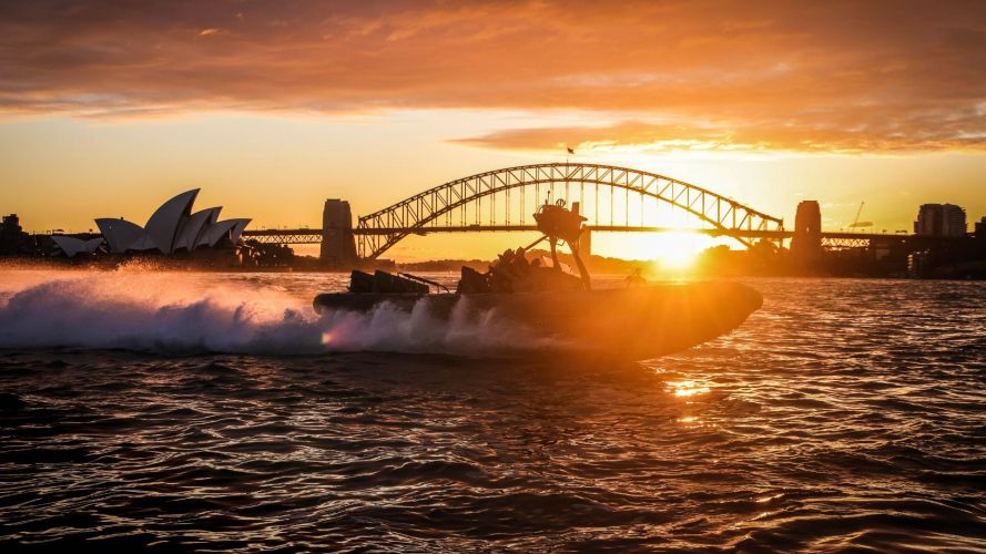 Here, 42 Commando rip through the waves against the backdrop of Sydney Harbour