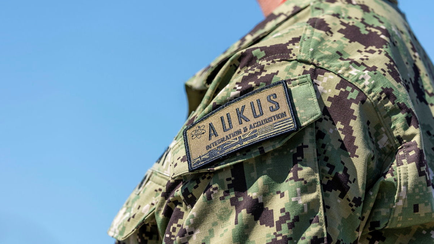 AUKUS written on military uniform