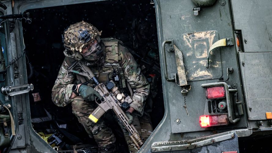A Royal Marine from 40 Commando prepares to disembark from a Viking