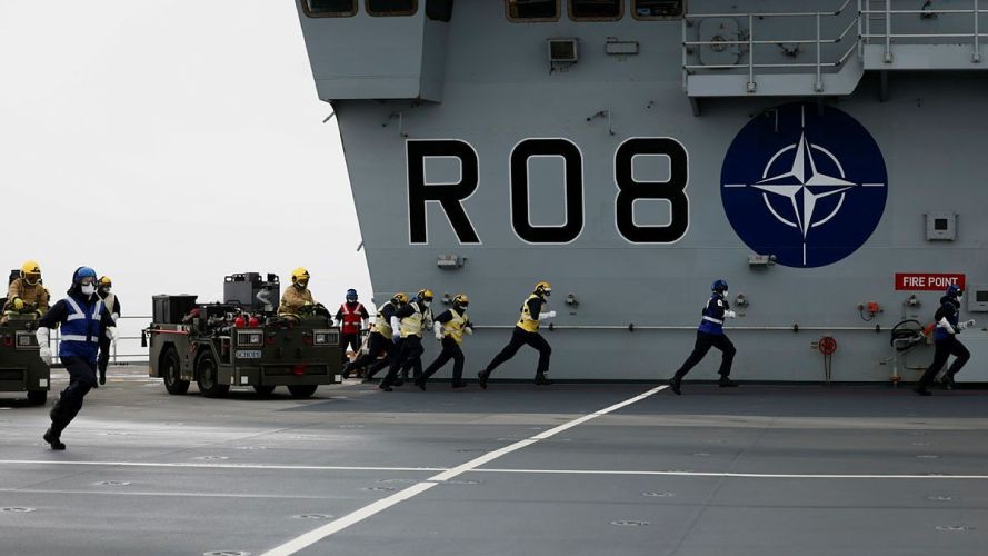 Aircraft handlers and aircraft engineers conduct a crash-on-deck exercise, on the flight deck of HMS Queen Elizabeth (Picture: MOD) HMS Queen Elizabeth crash-on-deck exercise