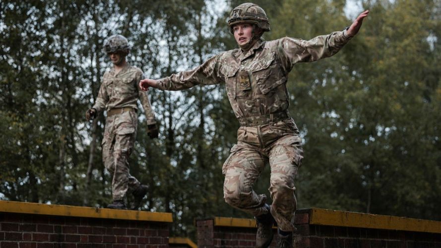 A member of 255 (Special Operations) Signal Squadron jumps off the balance wall as part of Battle PT (Picture: MOD) 255 (Special Operations) Signal Squadron taking part in Battle PT during their Formation Day cred MOD