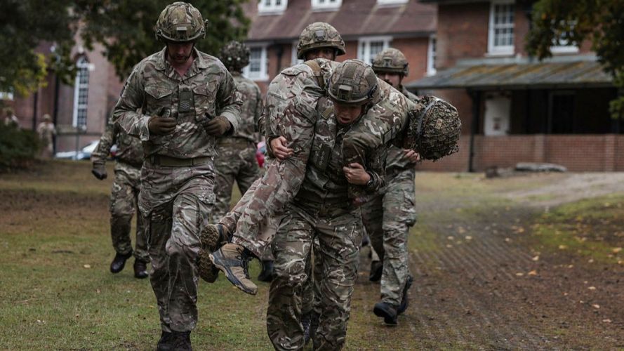 A member of 255 (Special Operations) Signal Squadron carries a casualty during Battle PT (Picture: MOD) 255 (Special Operations) Signal Squadron taking part in Battle PT during their Formation Day cred MOD