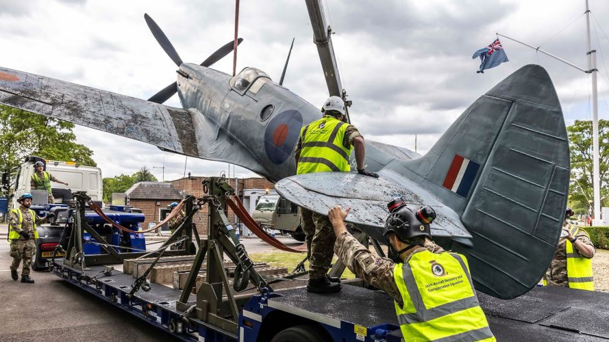 RAF Benson's gate guardian, a replica Spitfire PR19, is taken away for restoration - the aircraft will be refinished in a scheme worn by one of the photo recce units that flew out of Benson during the war