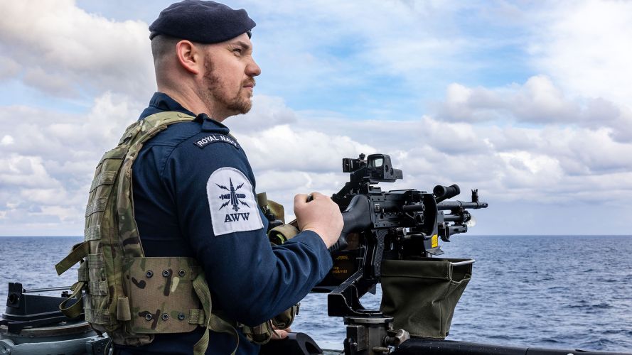 A GPMG gunner from the upper deck crew keeps a lookout as HMS Dragon heads to Cyprus to conduct air defence operations in the Eastern Mediterranean