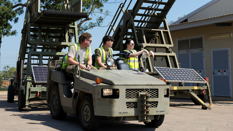 Two RAF Movers working alongside their Australian counterparts to move aircraft steps to the RAF Voyager on the pan at RAAF Base Darwin