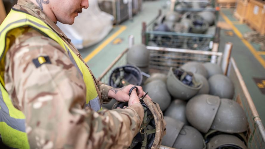 2nd Battalion The Royal Anglian Regiment soldier cuts ties of helmet to prepare it for packaging at MOD Donnington bound for Ukraine 31032022 CREDIT MOD CROWN COPYRIGHT.jpg