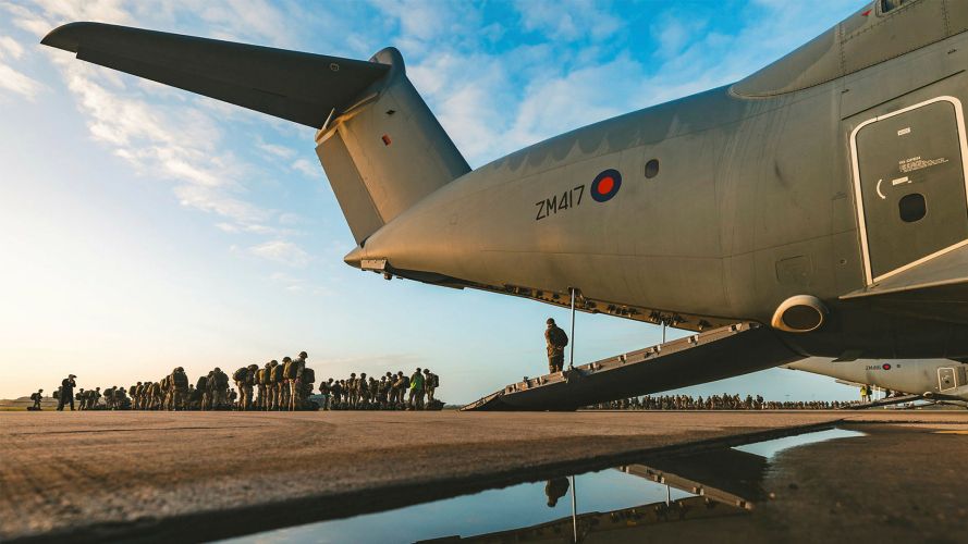 Members of 16 Air Assault Brigade prepare to board an A400M Atlas transport aircraft flying out of RAF Brize Norton ahead of a drop on Salisbury Plain