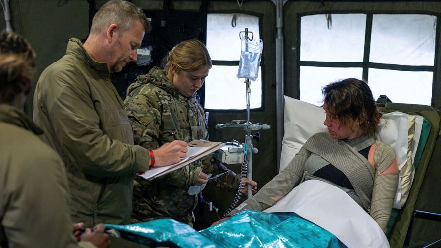A Wing Commander Partner (Medical Officer) cares for a simualted burns patient in the Aeromedical Staging Unit (ASU) at the Amari Airbase, Estonia (Picture: MOD)