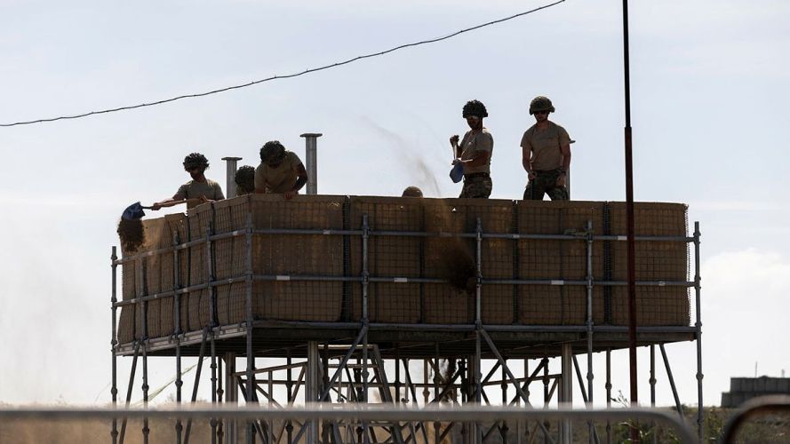 Personnel from the Royal Engineers operate under the intense Cyprus sun, carrying out essential construction and engineering tasks in support of British forces