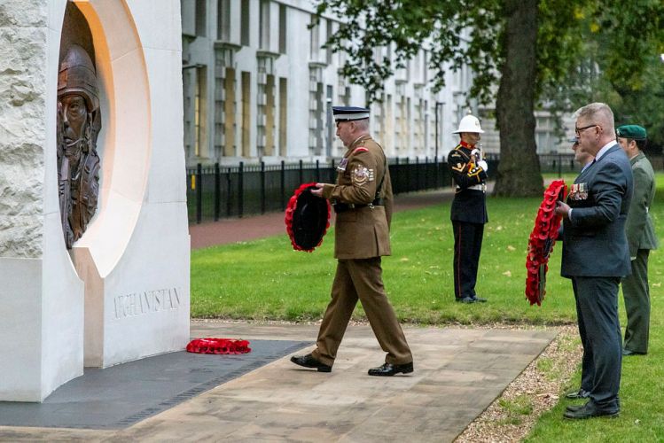 A Royal Marine Bugler played the Last Post as representatives from the services and veterans organisations laid wreaths at the Iraq and Afghanistan Memorial, London