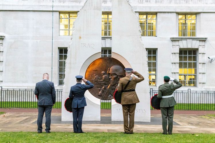 A Royal Marine Bugler played the Last Post while representatives from the services and veterans organisations laid wreaths at the Iraq and Afghanistan Memorial, London