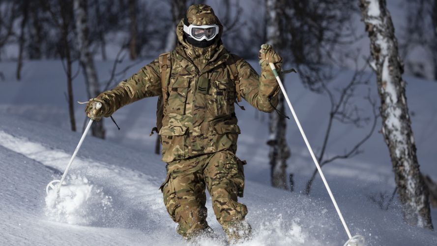 A marine skis through trees