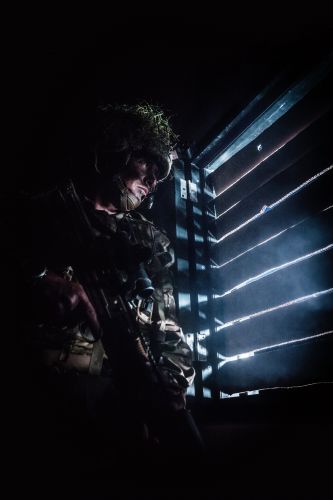 A Royal Marine from 40 Commando looks for enemy positions during an urban training exercise in the UK part of the winning selection by Amateur Photographer of the Marine James Clarke 02102020 CREDIT ROYAL NAVY