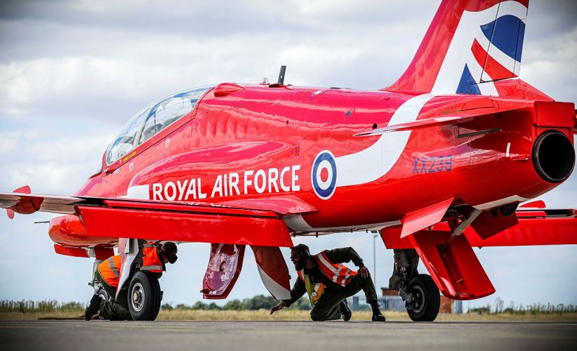 A member of the RAF checking over one of the Red Arrows