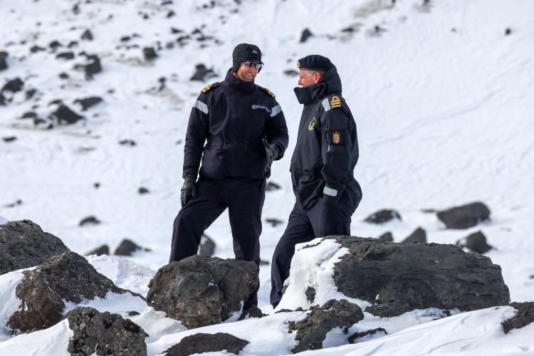 A member of the Royal Navy and a member of the Norwegian Navy on Jan Mayen 130422 CREDIT Royal Navy