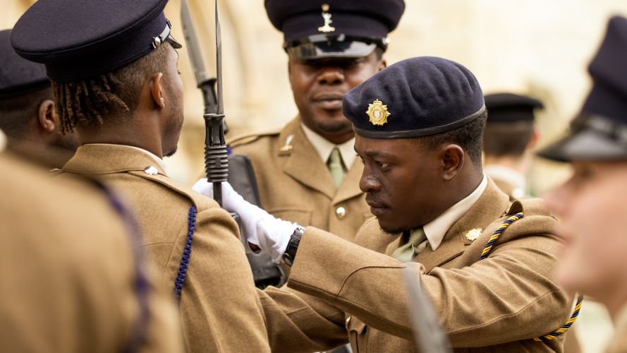 A soldier adjusts another soldier’s uniform before the 2 Signal Regiment freedom parade in York 19052022 CREDIT MOD Crown Copyright.jpg