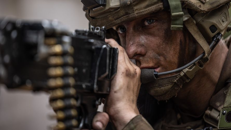 A soldier aiming a General Purpose Machine Gun (GPMG) on an urban assault during Exercise Iron Cyclone 27072023 CREDIT MOD.jpg