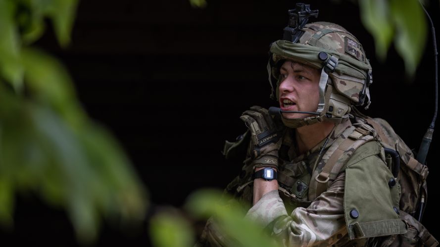 A soldier relays a message during an urban assault on Exercise Iron Cyclone 27072023 CREDIT MOD.jpg