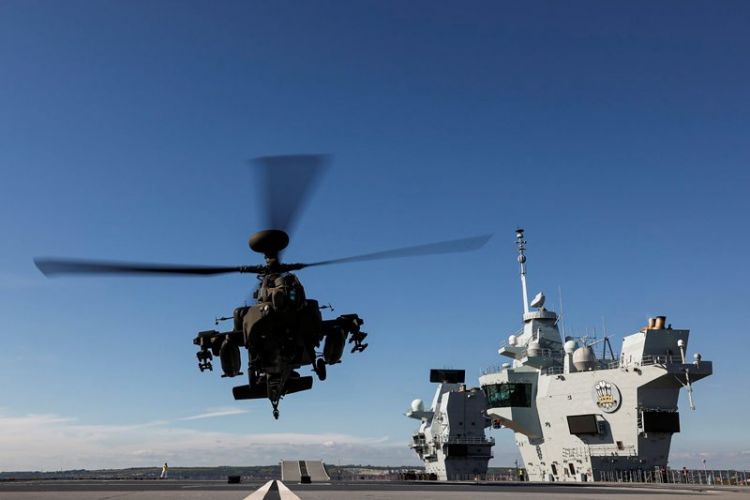 Army Air Corps Apache helicopters working with HMS Prince of Wales after joining the carrier in Portsmouth for trials (Picture: MOD).