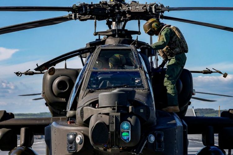 Army Air Corps Apache helicopters working with HMS Prince of Wales after joining the carrier in Portsmouth for trials (Picture: MOD).