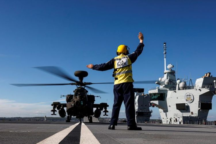 Army Air Corps Apache helicopters working with HMS Prince of Wales after joining the carrier in Portsmouth for trials (Picture: MOD).