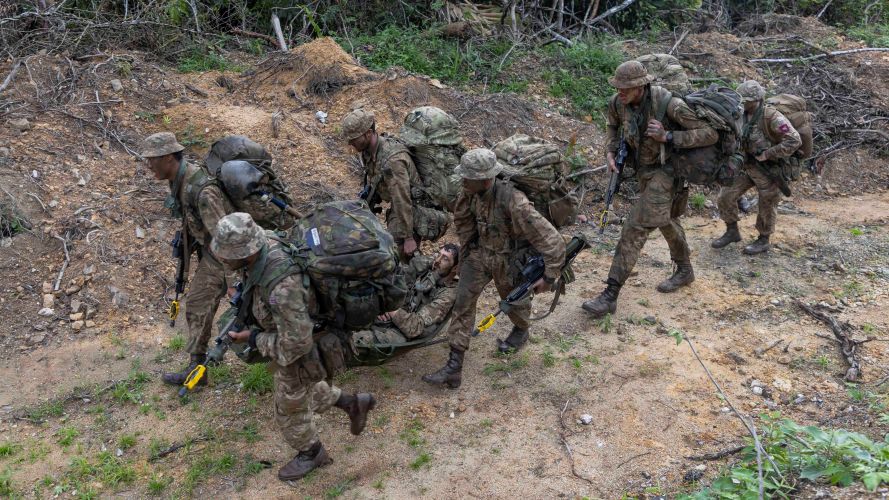 Airborne signallers during simulated casualty exercise carry soldier to safety 27012023 CREDIT MOD Crown Copyright .jpg
