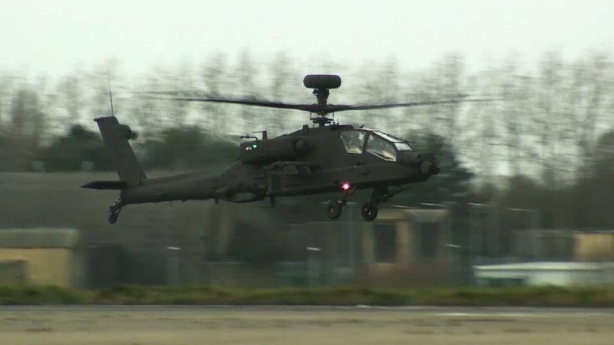 An Apache AH-64E helicopter in flight.