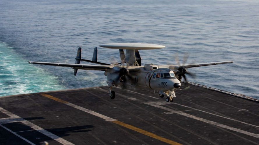 An E-2D Hawkeye - an airborne early warning and command and control aircraft - performs an arrested landing