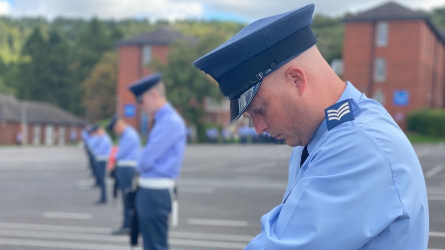 An airman bows his head during rehearsals for the Queen's funeral at RAF Halton.