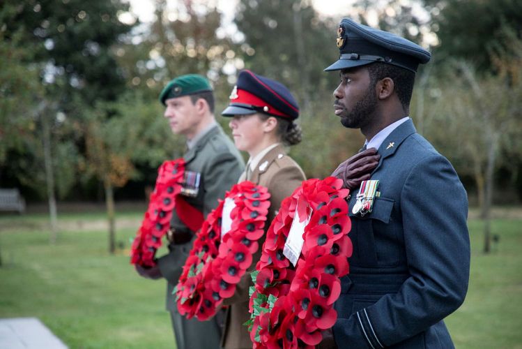 Armed Forces personnel laying wreaths in memory of the 457 British personnel who died during UK military operations in Afghanistan on the 20th anniversary of the start of US-led coalition airstrikes