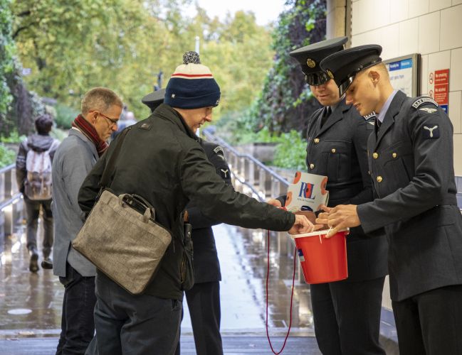 Armed Forces personnel selling poppies as part of London Poppy Appeal 