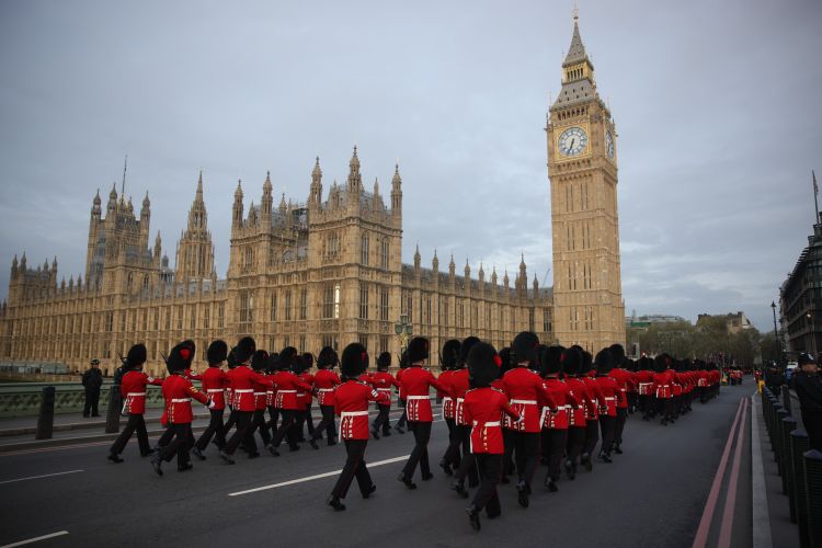 Army contingent march across Westminster Bridge before taking part in the coronation of King Charles III