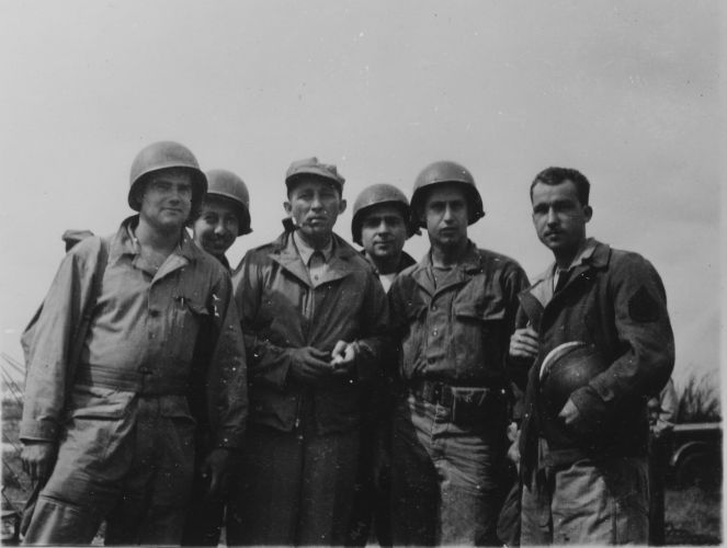 Bing Crosby (third left) with soldiers in France, 1944 (Picture: Decca Records).